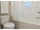 Bathroom with white tile, toilet and shower at 1052 Cascade Dr, Davenport, FL 33837