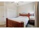Bedroom features a wooden bed frame and side table at 1052 Cascade Dr, Davenport, FL 33837