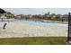 Resort-style community pool featuring a zero entry, sundeck, and seating areas at 1052 Cascade Dr, Davenport, FL 33837