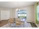 Bright dining area with sliding glass doors to the backyard patio at 1052 Cascade Dr, Davenport, FL 33837
