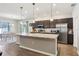 Modern kitchen with stainless steel appliances and a large island at 1052 Cascade Dr, Davenport, FL 33837