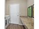 Laundry room with modern machines, a folding table and decor at 1052 Cascade Dr, Davenport, FL 33837