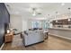 Bright, open-concept living room and kitchen featuring wood floors and modern finishes at 1052 Cascade Dr, Davenport, FL 33837