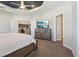 Comfortable main bedroom boasts a tray ceiling and an open en-suite bathroom at 1052 Cascade Dr, Davenport, FL 33837