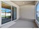 Covered patio with sliding glass doors leading to the dining area, great for indoor/outdoor entertaining at 1052 Cascade Dr, Davenport, FL 33837