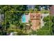 Aerial view of the house showcasing the sparkling pool, lush greenery, and serene outdoor living spaces at 1110 Greenwood St, Orlando, FL 32801