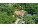Aerial view showing beautiful tile roof, mature landscaping, pristine pool and spacious grounds at 1110 Greenwood St, Orlando, FL 32801