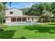 Beautiful backyard with a pool, well-manicured lawn, and lush landscaping at 1110 Greenwood St, Orlando, FL 32801