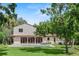 Charming backyard with a refreshing pool, a lush green lawn, and ample space for relaxing and entertaining at 1110 Greenwood St, Orlando, FL 32801
