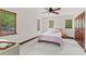 Bright bedroom featuring a ceiling fan, wood accents, and comfortable decor at 1110 Greenwood St, Orlando, FL 32801