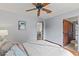 Comfortable bedroom with hardwood floors and ceiling fan, offering relaxing retreat at 1110 Greenwood St, Orlando, FL 32801