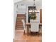 Charming dining room featuring tile floors, decorative stairs, and a wood table with upholstered chairs at 1110 Greenwood St, Orlando, FL 32801