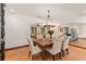 Charming dining room featuring rustic table, tile floors, and open access to other living spaces at 1110 Greenwood St, Orlando, FL 32801