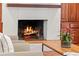 Close-up of a traditional fireplace with hearth, wood mantel, and flanking built-ins at 1110 Greenwood St, Orlando, FL 32801
