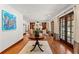 Open-concept foyer with hardwood floors, large area rug, and elegant French doors at 1110 Greenwood St, Orlando, FL 32801
