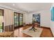 Beautiful foyer with hardwood floors, glass French doors, and a round wood table at 1110 Greenwood St, Orlando, FL 32801