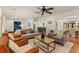 Large living room open to the kitchen, featuring hardwood floors and comfortable furniture at 1110 Greenwood St, Orlando, FL 32801