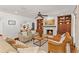 Cozy living room with built-in shelving, fireplace, and comfortable seating arrangement at 1110 Greenwood St, Orlando, FL 32801