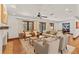 Spacious living room featuring French doors, hardwood flooring, and neutral furniture at 1110 Greenwood St, Orlando, FL 32801