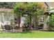Charming outdoor patio area featuring a pergola, comfortable seating, and lush landscaping in a serene backyard setting at 1110 Greenwood St, Orlando, FL 32801