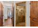 Shower with beautiful tile work, a glass door, and ample lighting at 1110 Greenwood St, Orlando, FL 32801