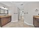 The bathroom features a double sink vanity and tile flooring throughout the area at 114 Dolcetto Dr, Davenport, FL 33897