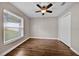Bedroom with ceiling fan, closet, window with blinds, and wood-look tile flooring at 114 Dolcetto Dr, Davenport, FL 33897