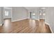 Open living space boasting wood-look floors, neutral walls, and access to the patio at 114 Dolcetto Dr, Davenport, FL 33897