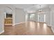 Spacious living area with wood-look flooring, arched doorways, and abundant natural light at 114 Dolcetto Dr, Davenport, FL 33897