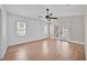 Comfortable main bedroom featuring wood-style floors, a ceiling fan, and access to a private patio at 114 Dolcetto Dr, Davenport, FL 33897