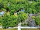 Aerial view of a secluded home nestled among mature trees, showcasing its private and peaceful setting at 1155 Taylor E Rd, Deland, FL 32724