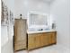 Bathroom boasting a double vanity, a marble countertop and an illuminated mirror at 1155 Taylor E Rd, Deland, FL 32724