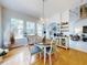 Bright dining area with wood floors, chandelier, and a view to the living room at 1155 Taylor E Rd, Deland, FL 32724