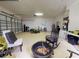 Well-equipped garage with a fire pit, multiple storage areas, and workspace at 1155 Taylor E Rd, Deland, FL 32724