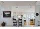Open kitchen with bar seating, modern appliances, and an adjacent dining area with French doors for an entertaining space at 1155 Taylor E Rd, Deland, FL 32724