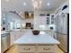Modern kitchen with white cabinets, stainless appliances, a spacious island, and hardwood floors at 1155 Taylor E Rd, Deland, FL 32724