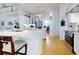 Bright kitchen features white cabinetry, marble counters, stainless appliances, and a breakfast bar at 1155 Taylor E Rd, Deland, FL 32724