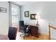 A quiet home office space with natural light and a comfortable executive chair at 1155 Taylor E Rd, Deland, FL 32724