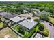 An aerial view of a neighborhood with lush greenery and tree-lined streets, highlighting the community's peaceful setting at 1157 Valley Creek Run, Winter Park, FL 32792