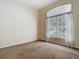 Vacant bedroom with a large window at 1157 Valley Creek Run, Winter Park, FL 32792
