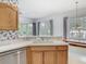 Bright kitchen featuring stainless steel appliances and wood cabinetry at 1157 Valley Creek Run, Winter Park, FL 32792