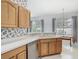 Bright kitchen featuring stainless steel appliances and wood cabinetry at 1157 Valley Creek Run, Winter Park, FL 32792