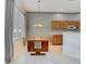 Eat-in kitchen with wood cabinets and unique decorative elements at 1157 Valley Creek Run, Winter Park, FL 32792
