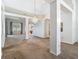 Open-concept living area with high ceilings, a chandelier, and natural light, offering ample space for entertaining at 1157 Valley Creek Run, Winter Park, FL 32792