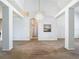 Spacious living room featuring high ceilings, stylish chandelier, and neutral tones, perfect for personalization at 1157 Valley Creek Run, Winter Park, FL 32792