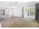 Large living room with sliding glass doors leading to outdoor patio at 1157 Valley Creek Run, Winter Park, FL 32792