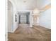 Bright and spacious living area featuring vaulted ceilings and a chandelier for an airy atmosphere at 1157 Valley Creek Run, Winter Park, FL 32792