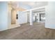 Bright living room featuring decorative beams and an open concept layout at 1157 Valley Creek Run, Winter Park, FL 32792