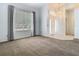 Spacious living room with ample natural light and a welcoming entryway, ready for your personal touch at 1157 Valley Creek Run, Winter Park, FL 32792
