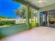 Screened-in patio with tile flooring overlooks the lush, manicured backyard at 1157 Valley Creek Run, Winter Park, FL 32792